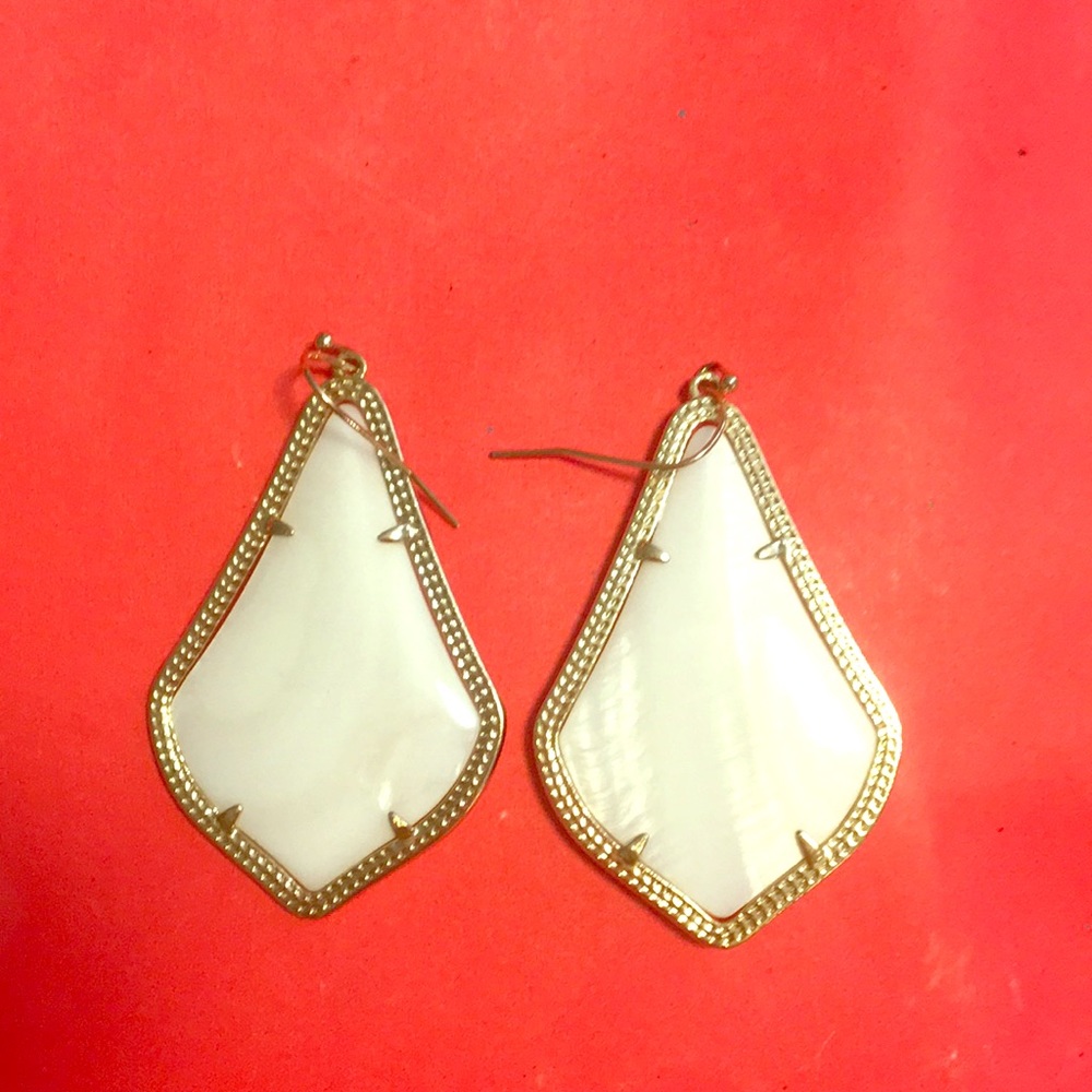White Kendra Scott earrings with gold detail